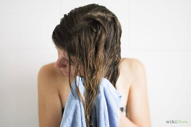 Fight hair frizz by pressing hair with towel, instead of rubbing
